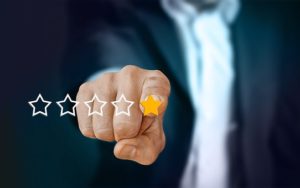 hand pointing at star review